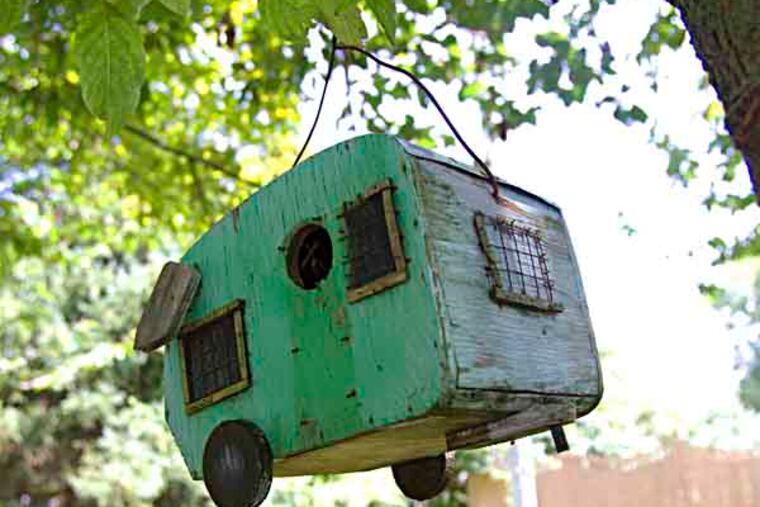 A camper shaped bird house hangs near the offices at Sea Grove Camping Resort, Ocean View, July 24, 2013. ( DAVID M WARREN / Staff Photographer )