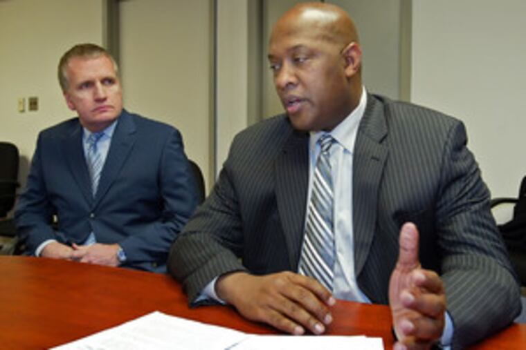 State Rep. Dwight Evans (right) is joined by supporter Richard Keaveney, president of Toppers Spa, at a news conference. Evans' gay platform also calls for a special police unit to deal with gay issues.