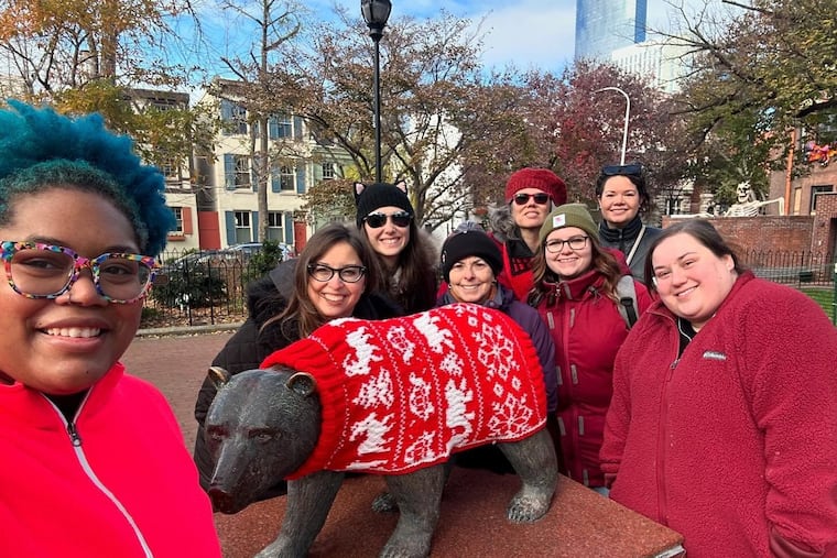 These are members of the Philadelphia Drunken Knitwits who participated in the creating of the sweaters for the animal statues in Fitler Square Park. They were photographed on the day of the sweater installation. From left to right: Britt Iascone, Allison Covey, Taylor Kroma-Wiley, Robin Lumb, Valerie Swinson Stillman, Emma Geiler, Rebecca MacLeon, and Rachel Lewack. Not pictured: Linda Ruggiero and DeAdra Walker.