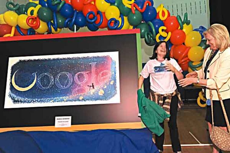 At Chestnut Ridge Middle School in Sewell, NJ, seventh grader Maria Iannone with her winning Google doodle sports a shirt with the doodle on it and gets congrats from vice principal Sheryl Lean on 5/1/13. ( APRIL SAUL / Staff )