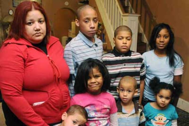 Jeanette Marcano moved into this Kensington house to provide more room for her seven grandchildren. She spent $10,000 of her own money to make it livable. Now, she could lose it at sheriff sale. (Sarah J. Glover/Staff)