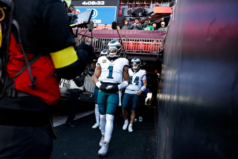 Philadelphia Eagles quarterback Jalen Hurts takes the field for warm ups before the game against the Washington Commanders at Northwest Stadium on Saturday, Dec. 20, 2025, in Landover, Md.