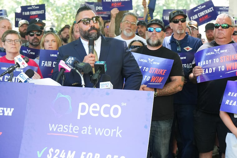 Larry Anastasi, IBEW Local 614 president, speaks to workers and union representatives who gathered in Washington Square Park on Thursday as the union announced a strike plan.