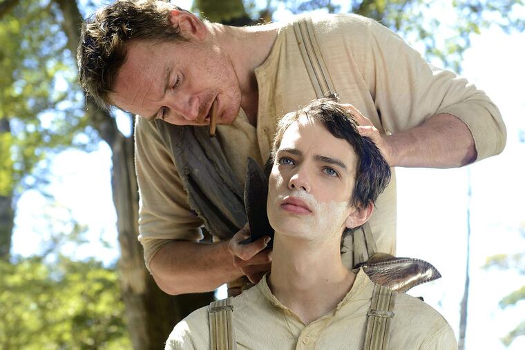 Frontier days: Michael Fassbender (left) and Kodi Smit-McPhee in John Maclean’s "Slow West." (Photo courtesy of A24 Films)