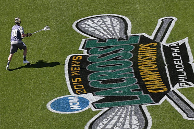 Edwin Glazener looks to pass the ball as Notre Dame practices for the Men's NCAA Division I Lacrosse Championships at Lincoln Financial Field in Philadelphia, Pa. on May 22, 2015. (David Maialetti/Staff Photographer)