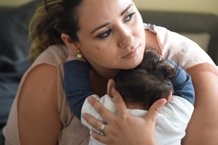 Maria Santa Maria at home with her son Lucas on Sept. 18. He was born March 7 without much of his skull; a condition that usually is immediately fatal.