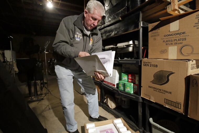 Ed "Heppy" Hepworth with the binders of notes he found in the basement of AMVETS Post 146.