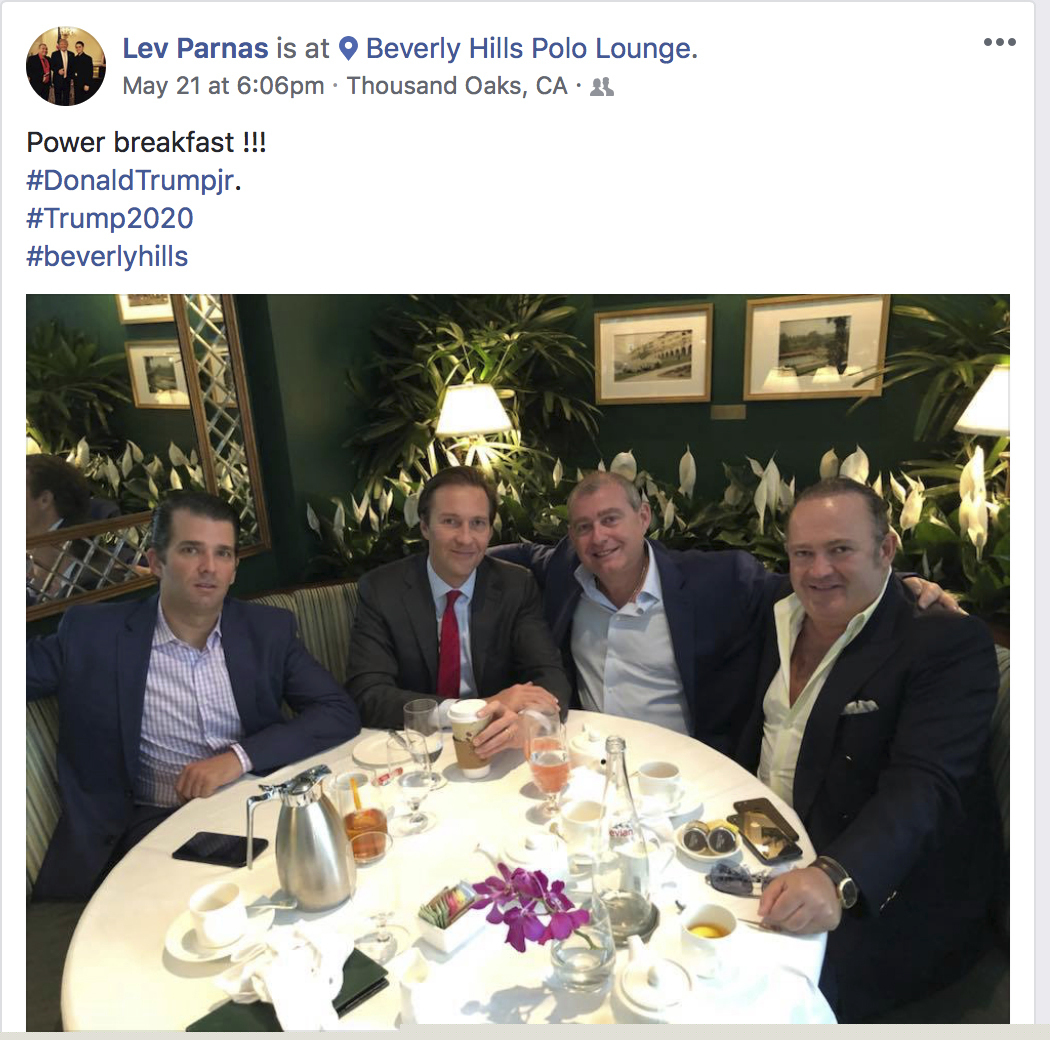 This Facebook screen shot provided by The Campaign Legal Center, shows from left, Donald Trump, Jr., Tommy Hicks, Jr., Lev Parnas and Igor Fruman, posted on May 21, 2018.