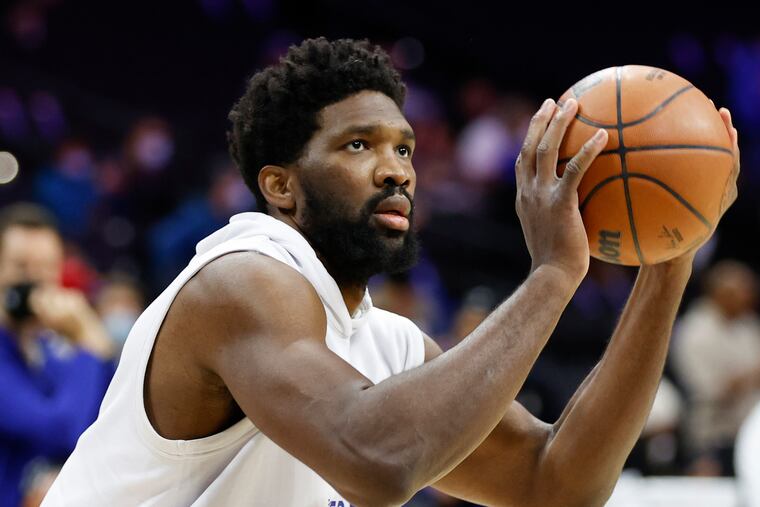Sixers center Joel Embiid shoots during warm-ups before the Sixers play the Minnesota Timberwolves on Saturday, November 27, 2021 in Philadelphia.