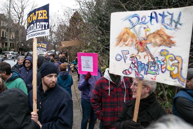 Unionized refinery workers, left, and anti-Trump protesters gathered outside of the St. Francis de Sales School in West Philadelphia on Wednesday, Feb. 5, 2020, where Vice President Mike Pence appeared. The union members want the government to support the resumption of oil processing at the Philadelphia Energy Solutions refinery, which shut down last year and is undergoing bankruptcy reorganization.