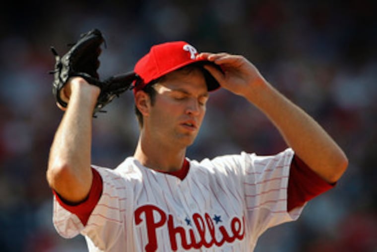 The Phils' J.A. Happ endures his brief debut after Carlos Beltran's homer. He never made it out of the fifth inning and was sent back to the minors.