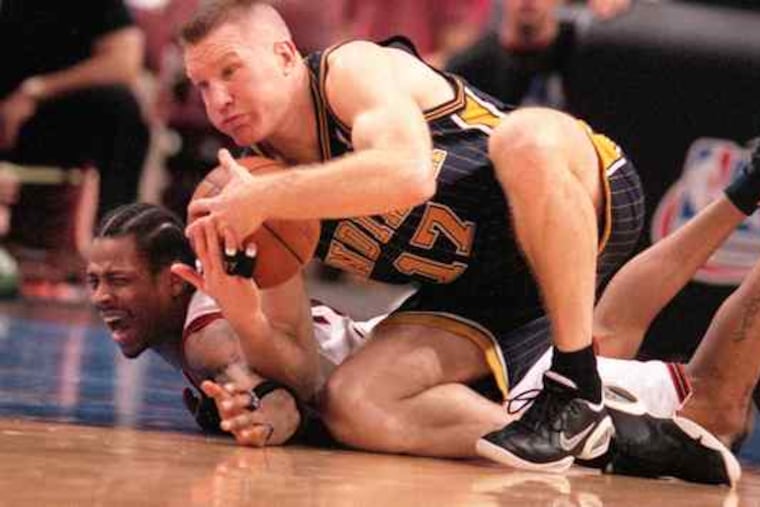 Former NBA star Chris Mullin, here tangling with Allen Iverson, is the older brother of Bensalem basketball coach John Mullin.