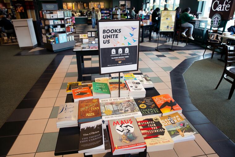 A display of banned books sits in a Barnes & Noble book store in Pittsford, N.Y. With legislators in Florida barring even the mention of being gay in classrooms and similar restrictions being considered in other states, books with LGBTQ+ themes remain the most likely targets of bans or attempted bans at public schools and libraries around the country.
