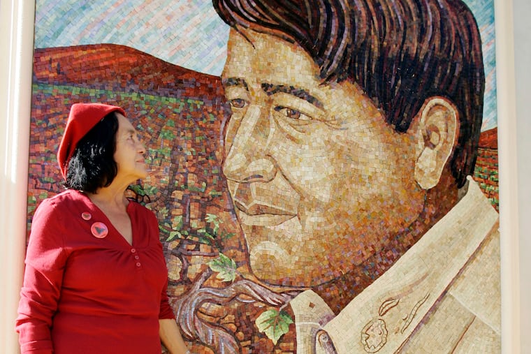 FILE - United Farm Workers co-founder Dolores Huerta looks at a mural of the late Cesar Chavez during a dedication of the Cesar Chavez Monument on the San Jose State University campus in San Jose, Calif., Thursday, Sept. 4, 2008. (AP Photo/Paul Sakuma, File)