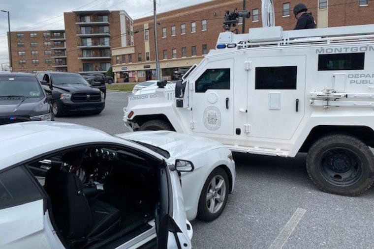 Law enforcement officials converge at the site in King of Prussia where two men were arrested Friday in the killing of a pregnant teenager in Philadelphia in September.