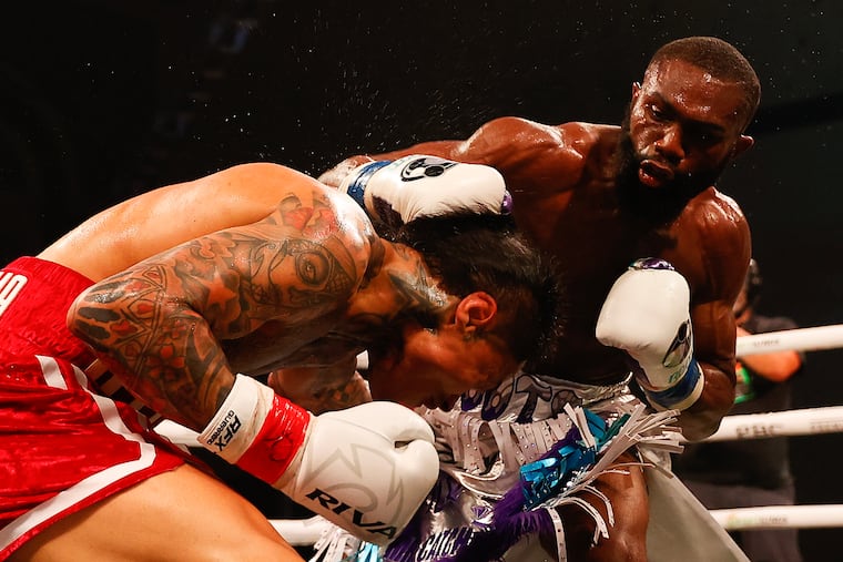 Philadelphia boxer Jaron "Boots" Ennis (right) lands a sixth-round punch on Roiman Villa during the Interim IBF welterweight title bout in Atlantic City on Saturday night.