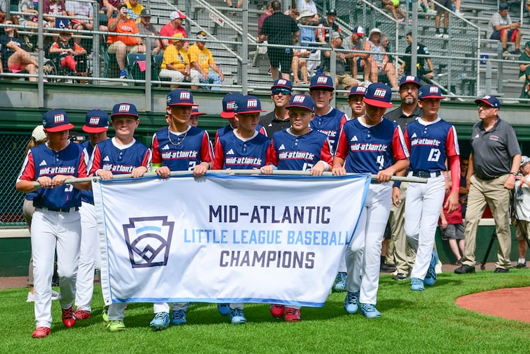 Players and coaches with the West Chester Little League enter Volunteer Stadium for team introductions during opening ceremonies of the 2026 Little League World Series in South Williamsport.