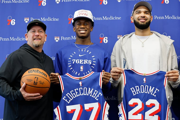 Sixers head coach Nick Nurse stands with 2025 Sixers draft selections VJ Edgecombe and Johni Broome during their introductory press conference at the Sixers' training complex in Camden, N.J. on Friday.