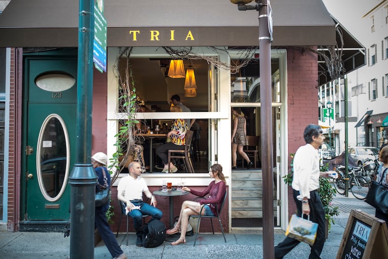 Pre-pandemic, guests sit in front of Tria Rittenhouse.