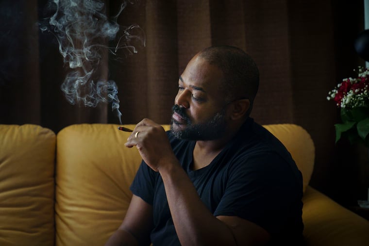 Veteran, organizer, and activist Bill Cobb smokes marijuana in his Philadelphia home.