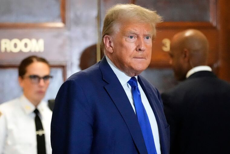 Former President Donald Trump speaks during a break in his civil business fraud trial at New York Supreme Court in October in New York.