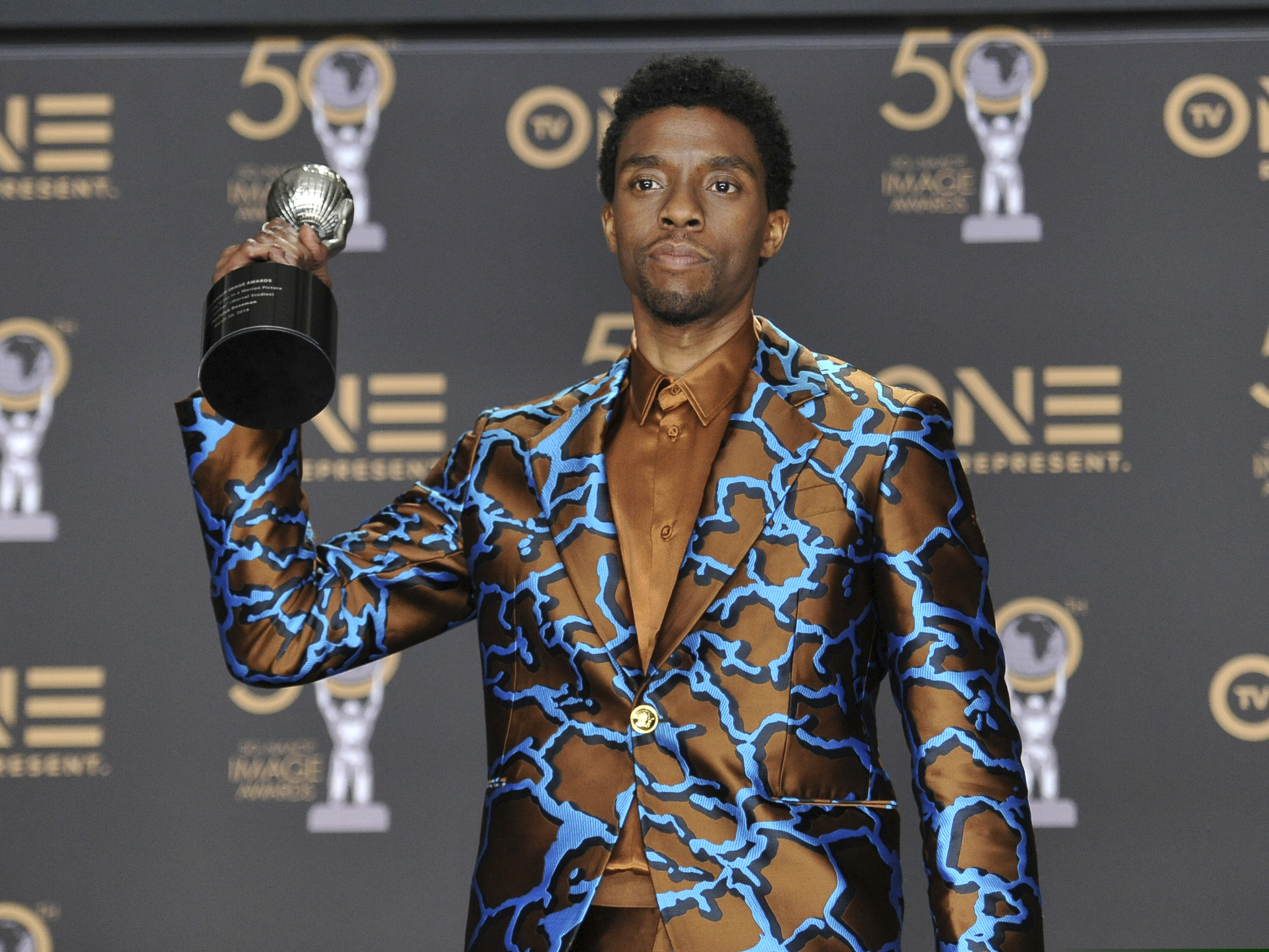 Chadwick Boseman poses in the press room with the award for outstanding actor in a motion picture for "Black Panther" at the 50th annual NAACP Image Awards at the Dolby Theatre in Los Angeles on March 30, 2019.
