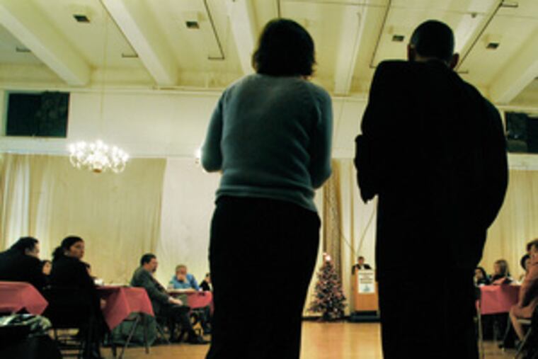 Emily Tulli of Legal Services of New Jersey asks Camden County Prosecutor Joshua Ottenberg a question. Angel Cordero of Excellent Education for Everyone waits his turn.