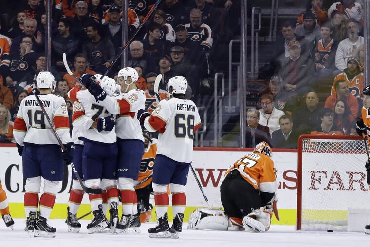 Florida players celebrate after a power-play goal by Aaron Ekblad gave the Panthers a 1-0 second-period lead Tuesday at the Wells Fargo Center.
