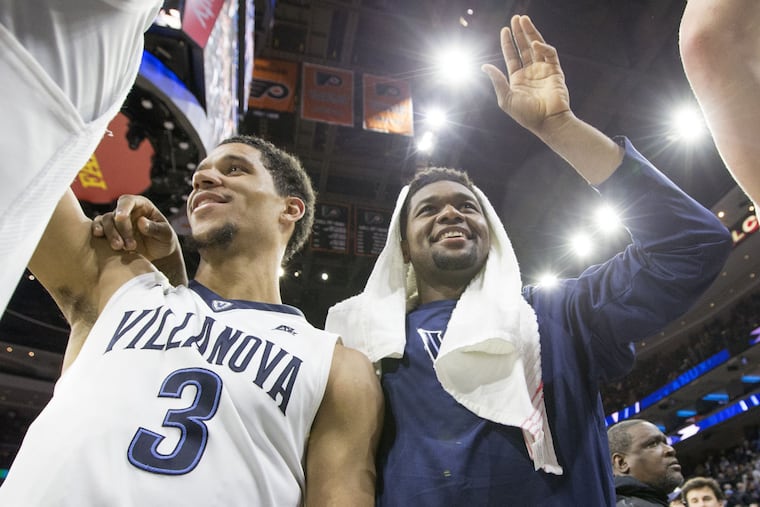 Villanova's Josh Hart (left) and Kris Jenkins celebrate after win over Marquette on Saturday.