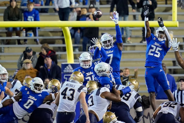 Navy's Bijan Nichols kicks a field goal against Tulsa on Oct. 29, 2021.