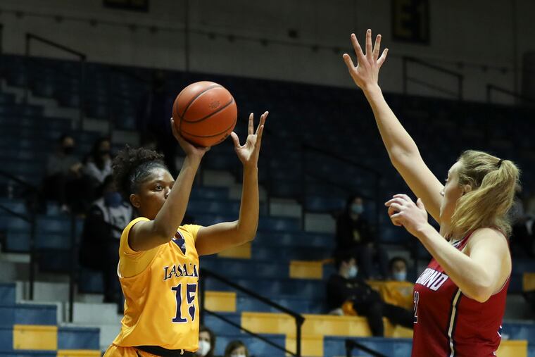La Salle guard Kayla Spruill shoots over Richmond forward Addie Budnik.