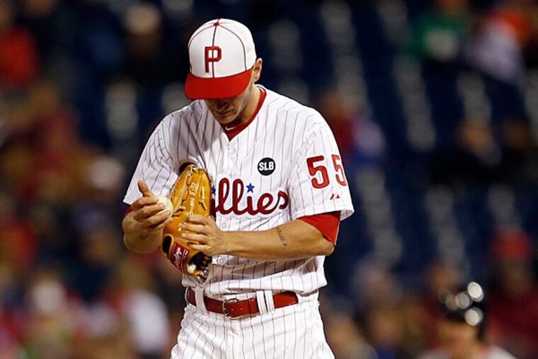 Phillies' pitcher David Buchanan stands on the pitchers mound after giving up a run batted in single toRed Sox Justin Masterson. (Yong Kim/Staff Photographer)