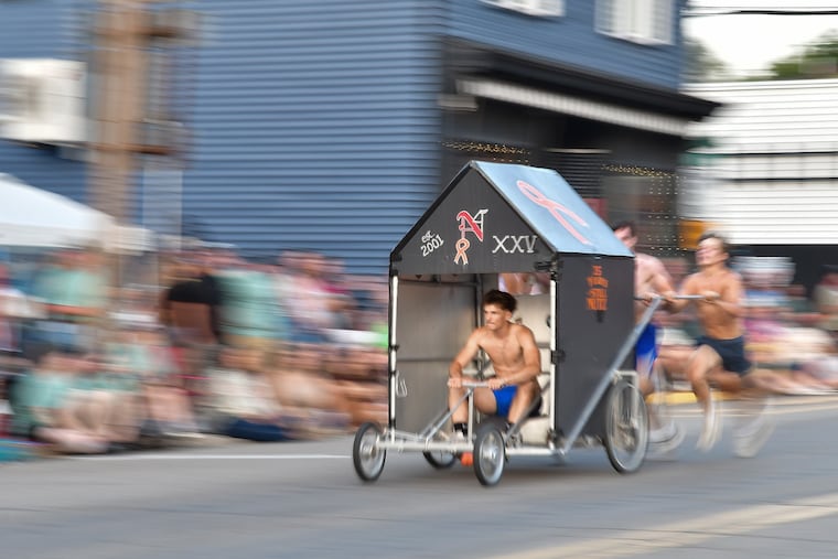 Team Nutz race down Main Street in the 25th Dushore Founder's Day Outhouse Races on Aug. 8, 2026, in Dushore, Pa.