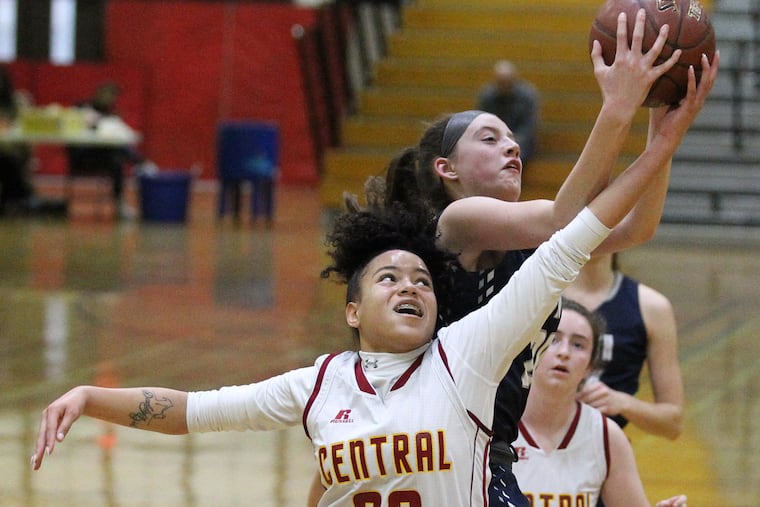 Bene Butler of Central and Sydney Blum, top, of Council Rock North battle for a rebound in a game on March 8, 2019. Butler scored 13 points in Central's win over Audenried on Friday.
