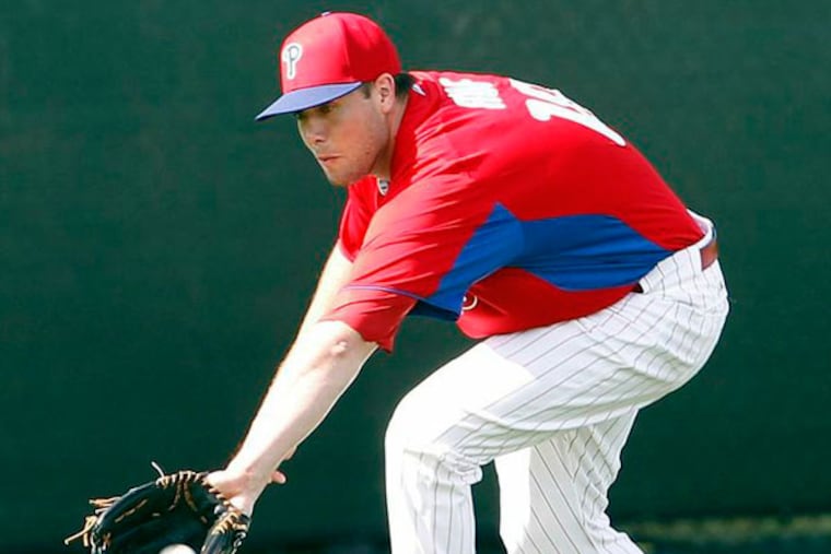 Darin Ruf catches the baseball during spring training drills in Clearwater, FL on Saturday, February 16, 2013. (Yong Kim/Staff Photographer)
