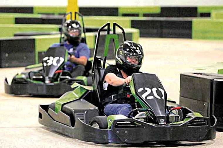 Sue and Wayne Scott speed through the track at Speed Raceway on Friday afternoon. Speed Raceway opened earlier this year, and is preparing for the summer rush. (LUKE RAFFERTY/Staff Photographer)
