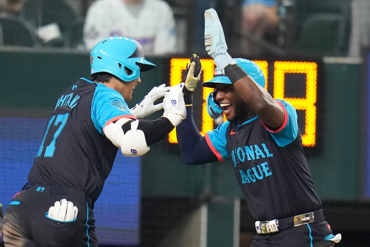 The National League's Shohei Ohtani, left, celebrates his three-run home run with Jurickson Profar during Tuesday's All-Star Game.