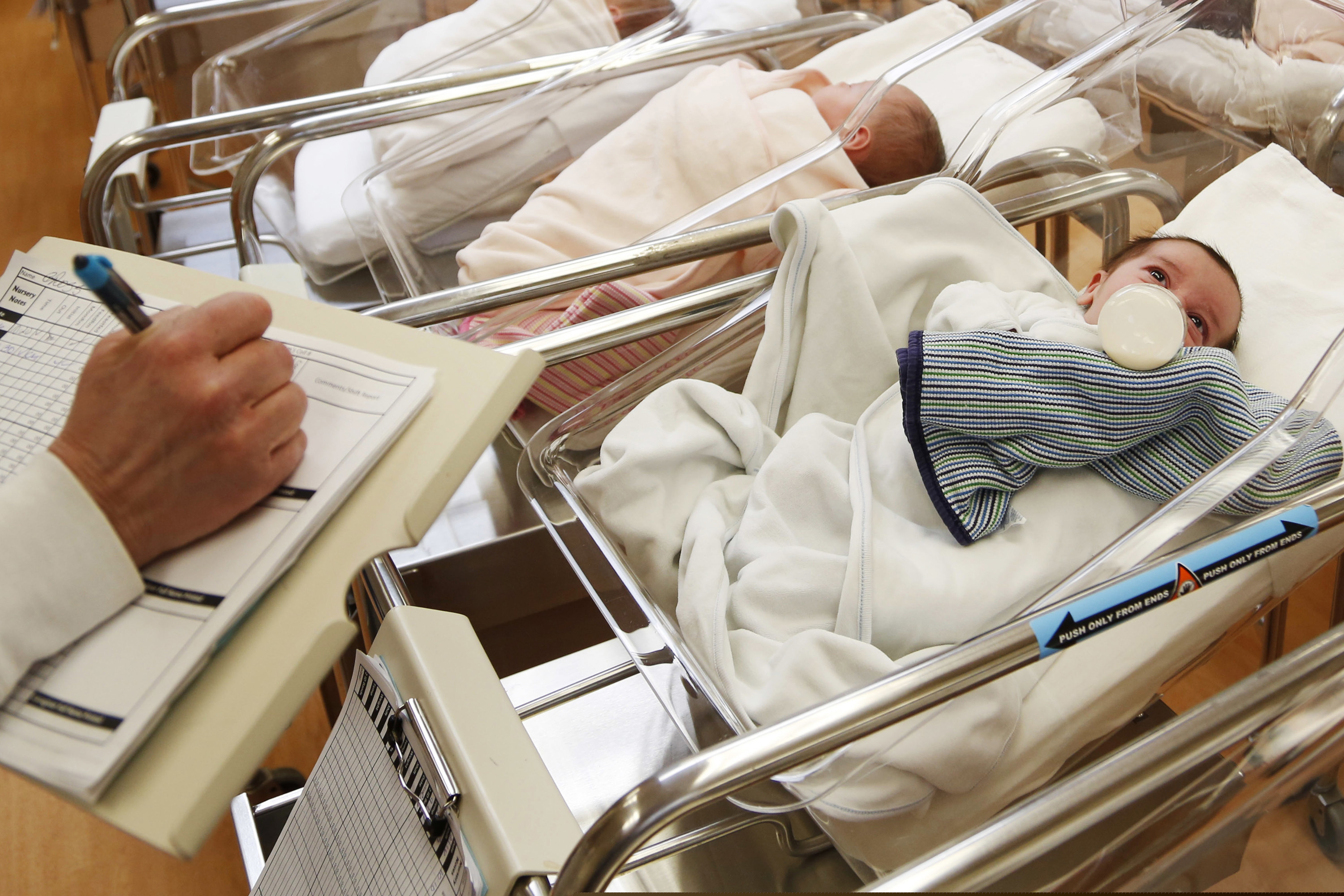 This Feb. 16, 2017 file photo shows newborn babies in the nursery of a postpartum recovery center in upstate New York. According to a government report released Wednesday, May 15, 2019, U.S. birth rates reached record lows for women in their teens and 20s, leading to the fewest babies in 32 years.
