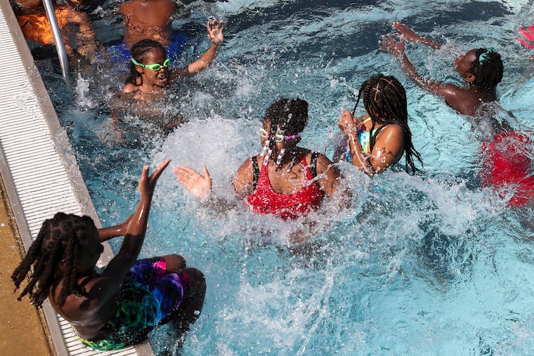Kids splash each other at Athletic Pool in the Brewerytown neighborhood of Philadelphia.