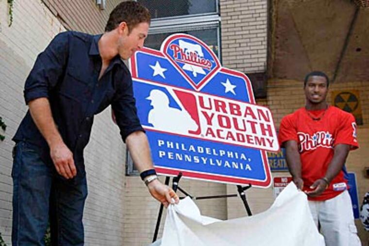 Chase Utley (left) and Penn Charter's Demetrius Jennings at the unveiling in September. (David Maialetti/Staff file photo)