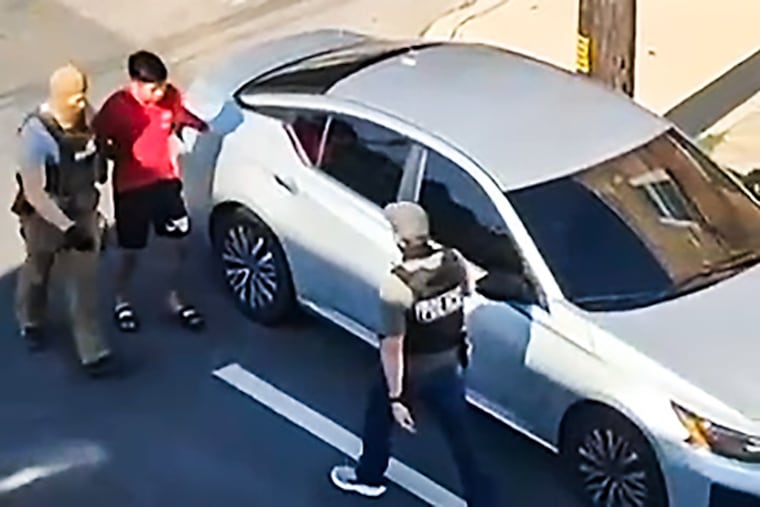 Immigration agents are seen on video as they take a Guatemalan men into custody near 20th and Morris Streets on July 6.