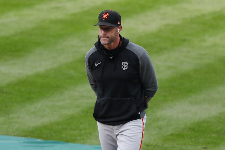 Giants manager Gabe Kapler walks the field during his team's batting practice at Citizens Bank Park.