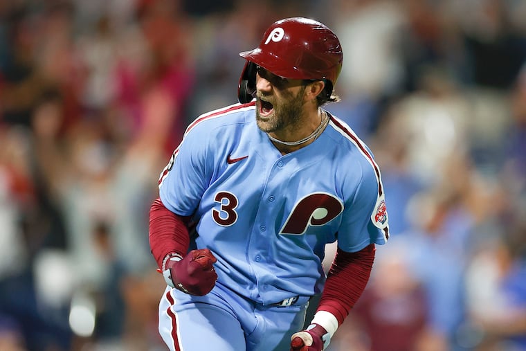 Bryce Harper, wearing one of the Phillies' alternate uniforms in 2021 game, will be wearing the powder blue and the cream uniforms eventually this season.