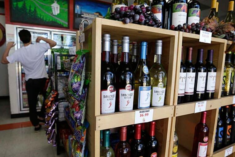 Washington stores that cater to bargain-hunting Canadanians - beer and wine are cheaper in the U.S. - worry about a proposed fee that would be placed on travelers entering the country by land. (AP)