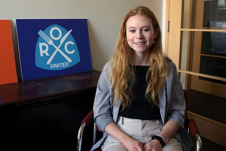 Elizabeth Stone, a restaurant server, poses for a photo at the office of Restaurant Opportunities Centers United, a restaurant workers' advocacy group, in New York, Monday, April 11, 2022. Just four months ago, city lawmakers overwhelmingly voted to require many ads for jobs in the nation's most populous city to include salary ranges, in the name of giving job applicants — particularly women and people of color — a better shot at fair pay. But the City Council in April voted to postpone implementation until November.