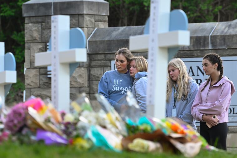 Students at a nearby school pay respects at a memorial for the people who were killed, at an entry to Covenant School in March in Nashville, Tenn.The U.S. is setting a record pace for mass killings in 2023, replaying the horror in a deadly loop roughly once a week so far this year.