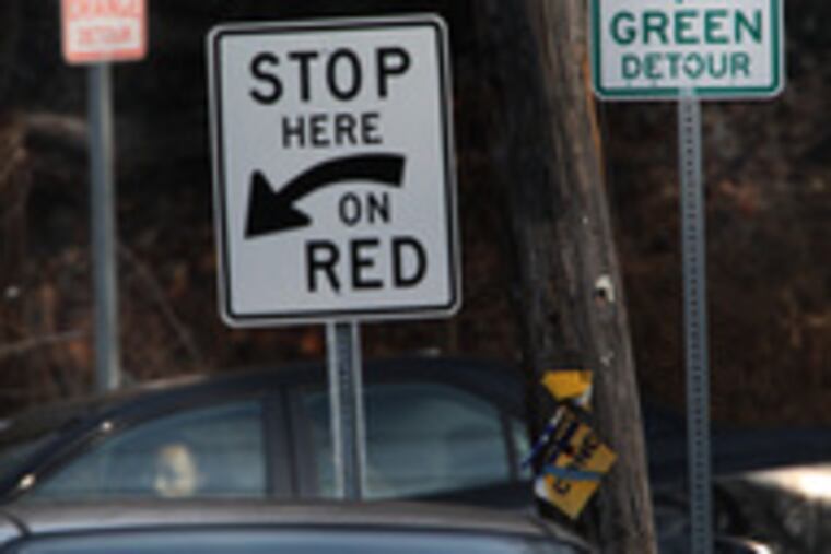 Among the new detour signs are an orange one (left) on Belmont Avenue near a Schuylkill Expressway entrance and a green one (right) on Rock Hill Road at Belmont.