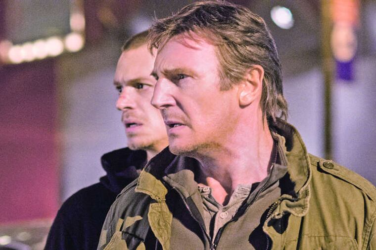 Liam Neeson (foreground) is a washed-up enforcer for gangsters who goes up against his old boss in order to save his son's life.