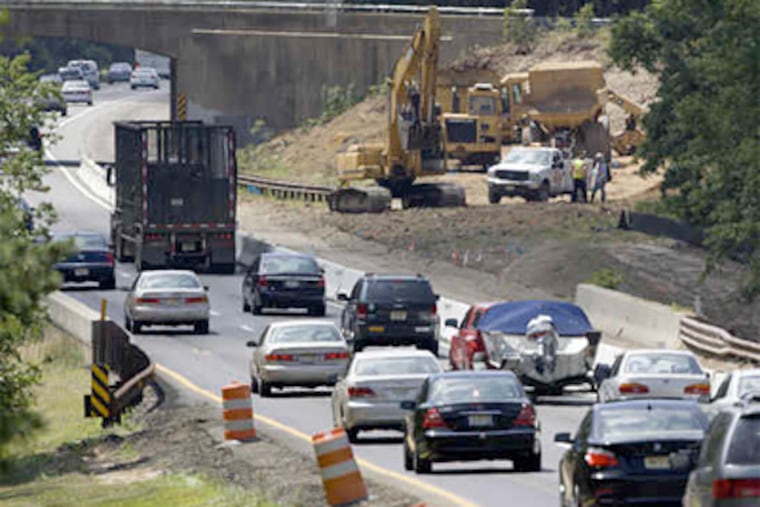 Southbound traffic slows around construction on the Garden State Parkway at Milepost 80near Toms River, N.J. Work to add lanes between there and Exit 63 began last week. (Ed Hille / Staff Photographer)