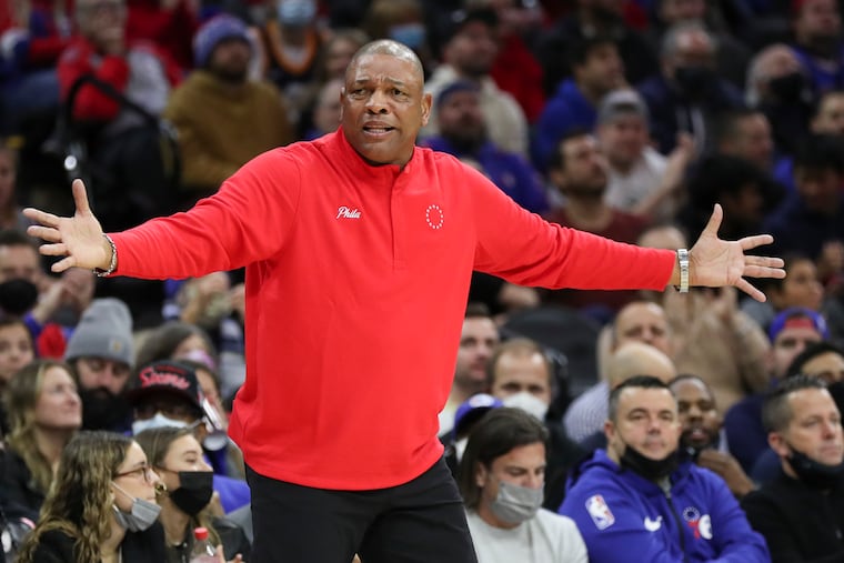 Sixers coach Doc Rivers raises his arms against the Utah Jazz on Thursday.